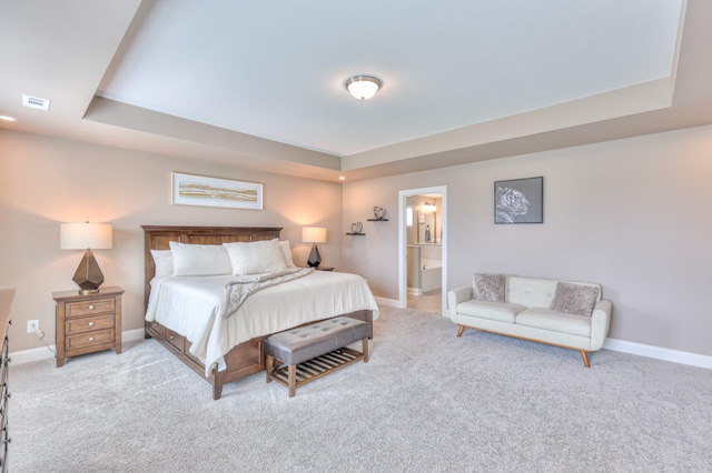 2064 Hedgelawn Dr, Lebanon, TN 37090 - carpeted bedroom featuring a tray ceiling and ensuite bath