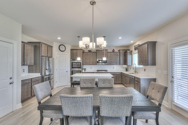 2064 Hedgelawn Dr, Lebanon, TN 37090 - dining area featuring a chandelier, light wood-style flooring, and recessed lighting