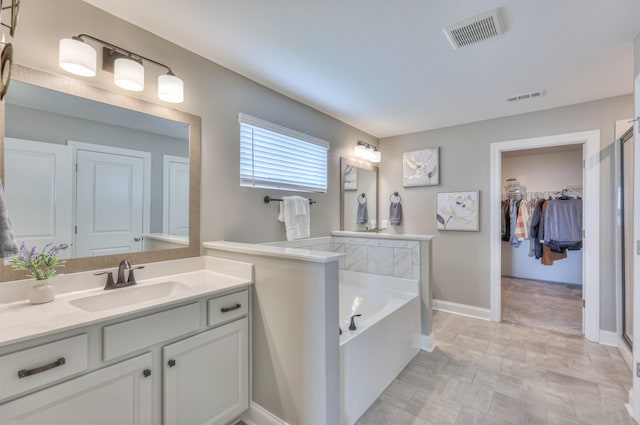 2064 Hedgelawn Dr, Lebanon, TN 37090 - full bath with vanity, a garden tub, a walk in closet, and an enclosed shower