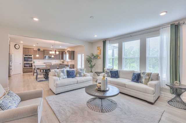 2064 Hedgelawn Dr, Lebanon, TN 37090 - living room with recessed lighting, light wood-style floors, and a chandelier