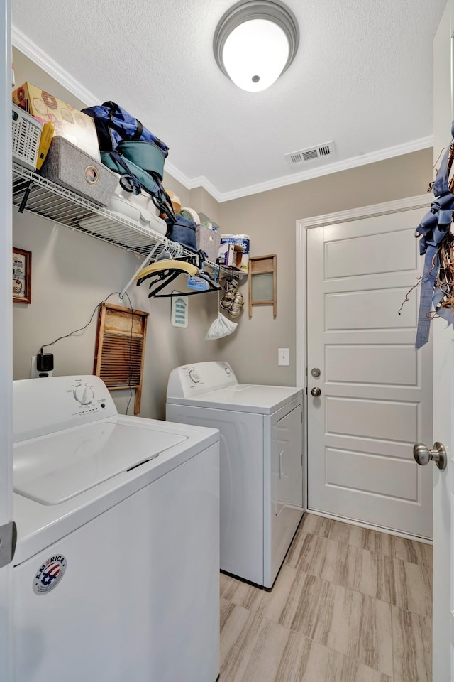 3424 Learning Ln, Murfreesboro, TN 37128 - laundry room with washer and clothes dryer, ornamental molding, and a textured ceiling