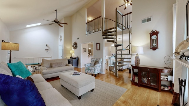 281 Glenstone Cir, Brentwood, TN 37027 - living area with a ceiling fan, light wood-style flooring, stairway, and high vaulted ceiling