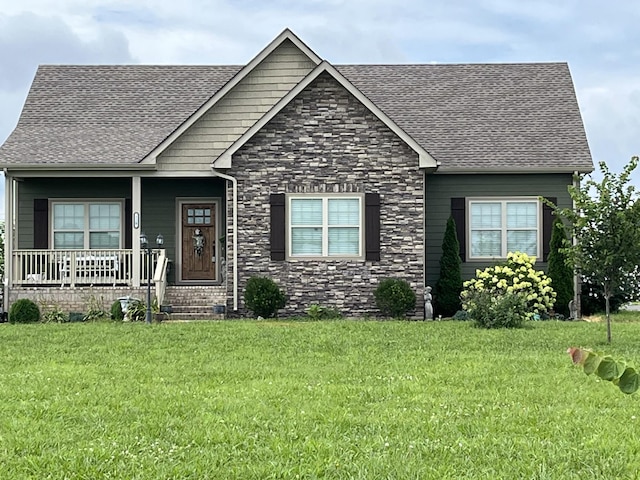 210 Hollow Tree Cir, Castalian Springs, TN 37031 - view of front of property featuring a shingled roof, a porch, a front yard, and stone siding