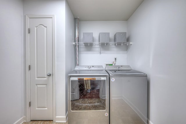 1005 Lark Ct, Spring Hill, TN 37174 - laundry area featuring separate washer and dryer and baseboards