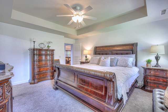 1005 Lark Ct, Spring Hill, TN 37174 - bedroom featuring carpet, a tray ceiling, and a ceiling fan