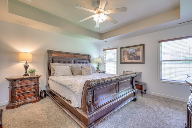 1005 Lark Ct, Spring Hill, TN 37174 - carpeted bedroom with a tray ceiling and ceiling fan