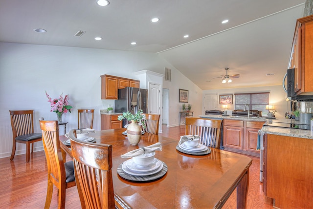 1005 Lark Ct, Spring Hill, TN 37174 - dining room featuring vaulted ceiling, a ceiling fan, recessed lighting, and light wood-style flooring