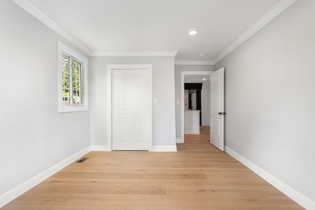 310 E Highland Dr, Columbia, TN 38401 - unfurnished bedroom featuring recessed lighting, crown molding, and light wood-type flooring