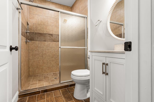 310 E Highland Dr, Columbia, TN 38401 - full bathroom with a shower stall, vanity, and wood finished floors