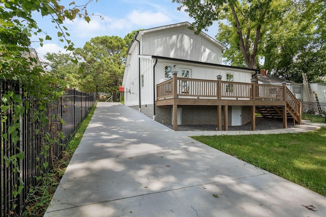 310 E Highland Dr, Columbia, TN 38401 - view of front of property with a wooden deck, concrete driveway, and stairway