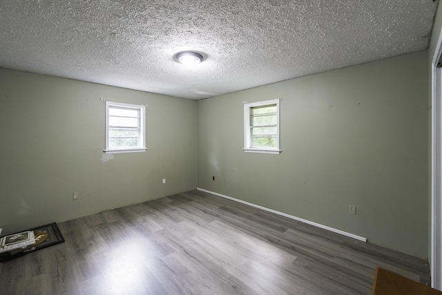 55 Lancaster Ln, Parsons, TN 38363 - unfurnished room featuring wood finished floors and a textured ceiling