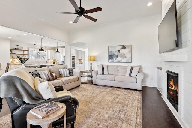 4376 Pretoria Run, Murfreesboro, TN 37128 - living room with ceiling fan, a large fireplace, wood-type flooring, arched walkways, and recessed lighting
