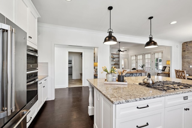 4376 Pretoria Run, Murfreesboro, TN 37128 - kitchen featuring stainless steel appliances, light stone countertops, white cabinets, ceiling fan, and hanging light fixtures