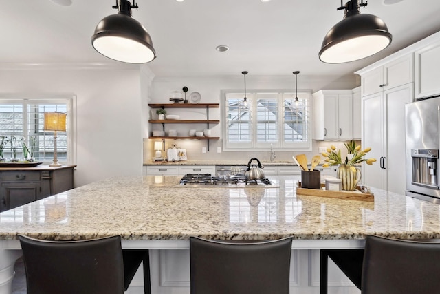 4376 Pretoria Run, Murfreesboro, TN 37128 - kitchen with appliances with stainless steel finishes, a large island, light stone countertops, white cabinets, and recessed lighting