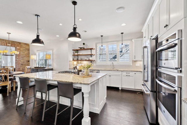 4376 Pretoria Run, Murfreesboro, TN 37128 - kitchen with freestanding refrigerator, white cabinetry, a kitchen island, recessed lighting, and light stone counters