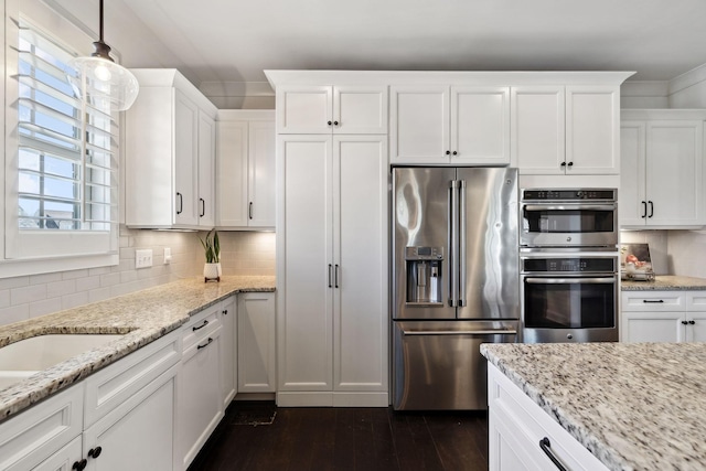 4376 Pretoria Run, Murfreesboro, TN 37128 - kitchen with stainless steel appliances, white cabinets, dark wood-style flooring, backsplash, and crown molding