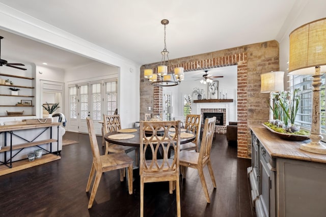 4376 Pretoria Run, Murfreesboro, TN 37128 - dining room featuring a ceiling fan, dark wood finished floors, plenty of natural light, and a brick fireplace