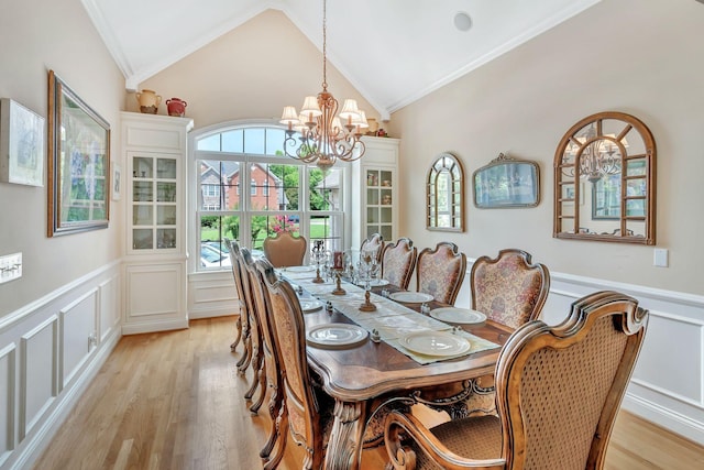 1660 Stokley Ln, Old Hickory, TN 37138 - dining space featuring crown molding, a chandelier, a decorative wall, wainscoting, and light wood-style flooring