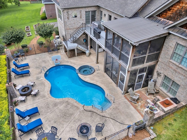 1660 Stokley Ln, Old Hickory, TN 37138 - view of pool featuring a sunroom, a fire pit, a patio area, a fenced backyard, and stairway