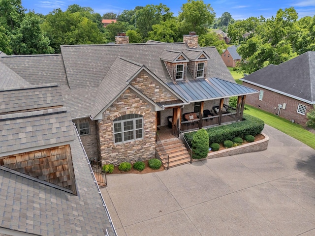1660 Stokley Ln, Old Hickory, TN 37138 - view of front of home with a chimney, covered porch, stone siding, and a standing seam roof