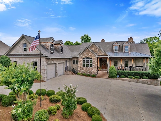 1660 Stokley Ln, Old Hickory, TN 37138 - view of front of house featuring stone siding, concrete driveway, a porch, and an attached garage