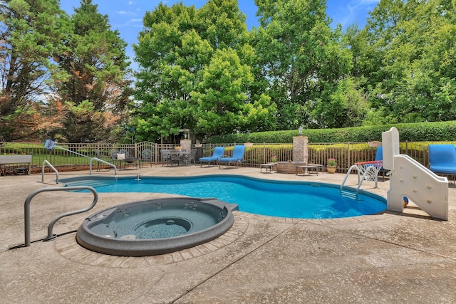 1660 Stokley Ln, Old Hickory, TN 37138 - view of pool with a patio, view of wooded area, and an in-ground hot tub