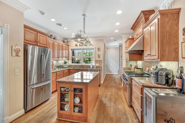 1660 Stokley Ln, Old Hickory, TN 37138 - kitchen with appliances with stainless steel finishes, ventilation hood, ornamental molding, light stone countertops, and tasteful backsplash