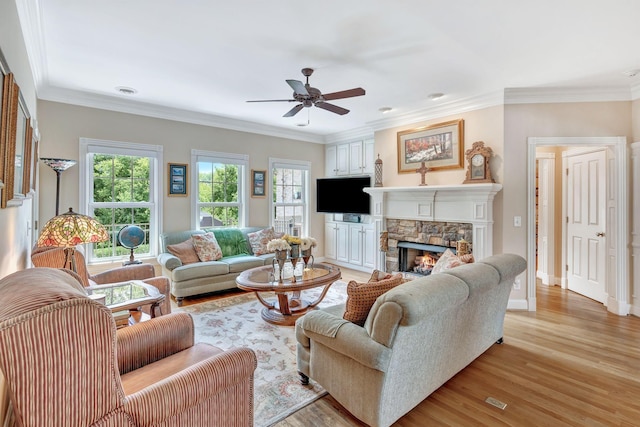 1660 Stokley Ln, Old Hickory, TN 37138 - living area with a ceiling fan, plenty of natural light, a fireplace, light wood-style floors, and ornamental molding