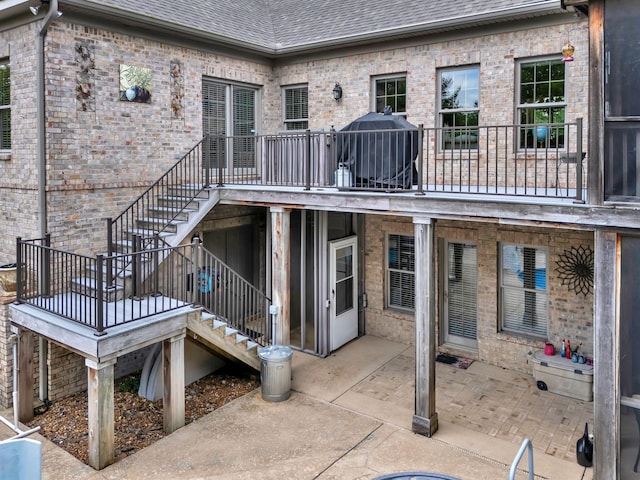 1660 Stokley Ln, Old Hickory, TN 37138 - rear view of property with stairway, roof with shingles, a patio, and brick siding