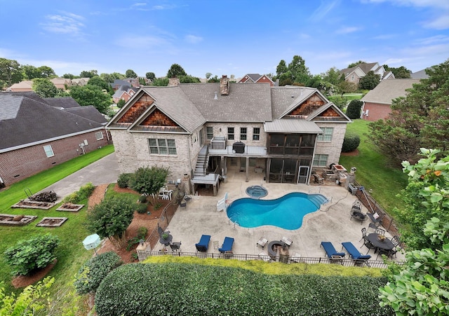 1660 Stokley Ln, Old Hickory, TN 37138 - rear view of property featuring a sunroom, a fenced backyard, a chimney, a patio area, and stairs