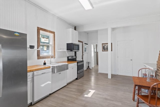 584 Limestone Ave, Lewisburg, TN 37091 - kitchen featuring stainless steel appliances, wooden counters, light wood-style flooring, and white cabinets