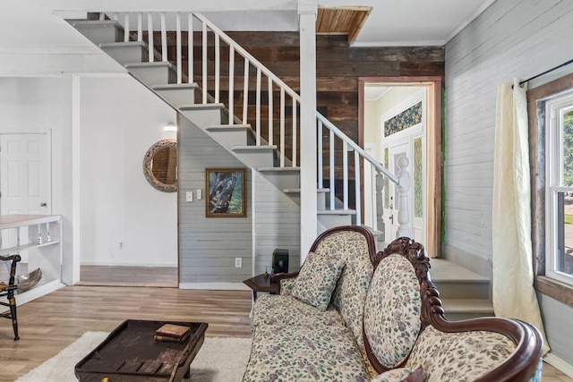 584 Limestone Ave, Lewisburg, TN 37091 - living area featuring stairway, wood finished floors, wooden walls, and ornamental molding