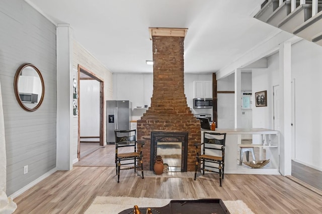 584 Limestone Ave, Lewisburg, TN 37091 - living area featuring light wood finished floors, ornate columns, and a baseboard heating unit