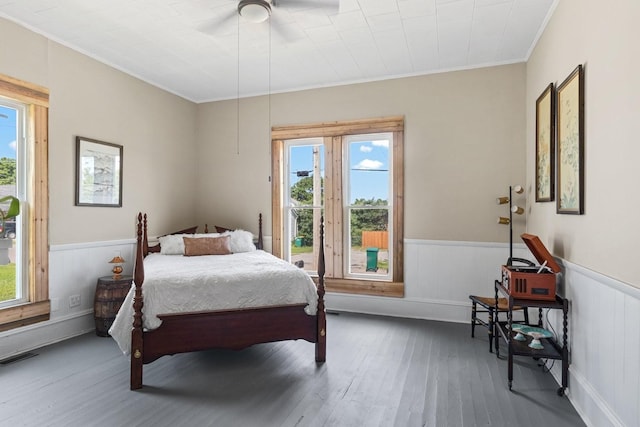 584 Limestone Ave, Lewisburg, TN 37091 - bedroom featuring wood-type flooring, ornamental molding, multiple windows, and wainscoting