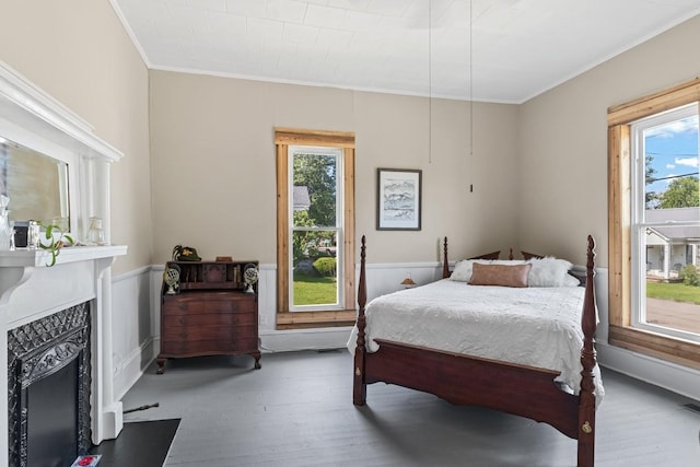 584 Limestone Ave, Lewisburg, TN 37091 - bedroom with crown molding, wood finished floors, a fireplace, multiple windows, and wainscoting