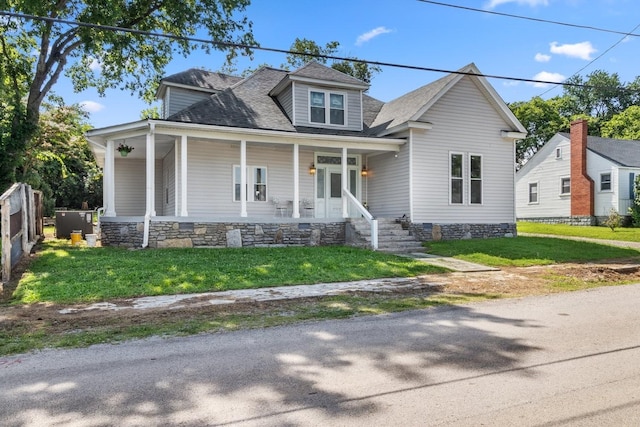 584 Limestone Ave, Lewisburg, TN 37091 - view of front facade with roof with shingles, a porch, and a front lawn