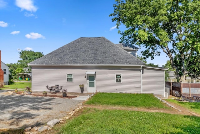 584 Limestone Ave, Lewisburg, TN 37091 - back of house with roof with shingles, a yard, and a patio
