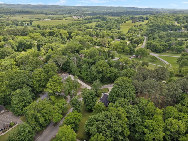 1148 Green Valley Dr, Lewisburg, TN 37091 - aerial view of property and surrounding area featuring a heavily wooded area