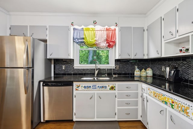 1148 Green Valley Dr, Lewisburg, TN 37091 - kitchen featuring appliances with stainless steel finishes, tasteful backsplash, crown molding, and dark countertops