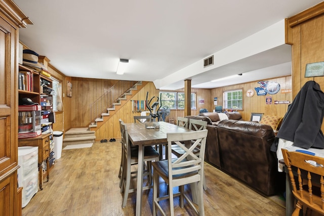 1148 Green Valley Dr, Lewisburg, TN 37091 - dining room featuring wood walls, stairway, and light wood finished floors