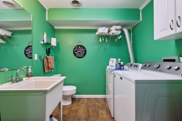 1148 Green Valley Dr, Lewisburg, TN 37091 - washroom with separate washer and dryer, wood finished floors, ornamental molding, and wet bar