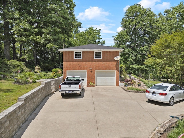 1148 Green Valley Dr, Lewisburg, TN 37091 - view of side of property with concrete driveway, brick siding, and a garage