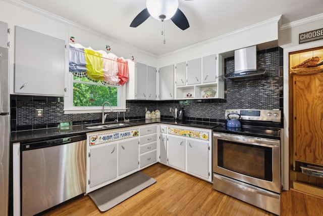 1148 Green Valley Dr, Lewisburg, TN 37091 - kitchen with stainless steel appliances, wall chimney exhaust hood, dark countertops, open shelves, and crown molding