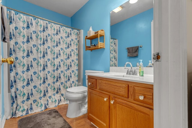 1530 Potter Dr, Columbia, TN 38401 - full bath with vanity, wood finished floors, and a shower with shower curtain