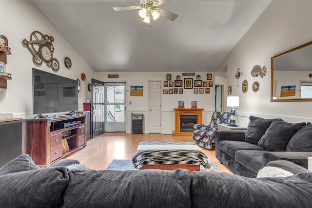 1530 Potter Dr, Columbia, TN 38401 - living area with light wood-style floors, vaulted ceiling, ceiling fan, and a glass covered fireplace