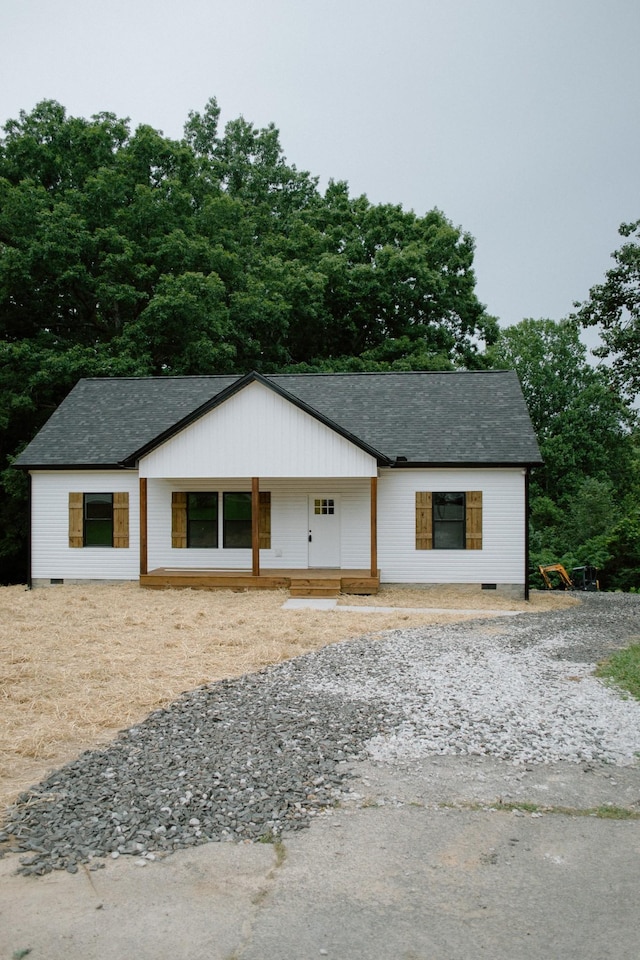 3119 Country Side Dr, Centerville, TN 37033 - modern farmhouse style home with a porch, a shingled roof, crawl space, and gravel driveway