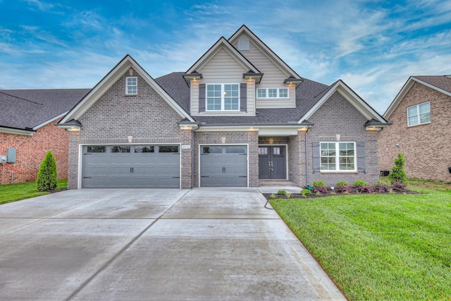 4016 Runyan Cv, Murfreesboro, TN 37127 - view of front of home with concrete driveway, a front lawn, brick siding, and roof with shingles
