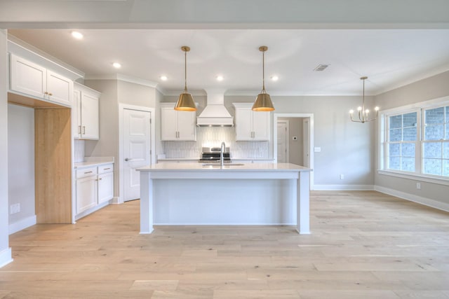 4016 Runyan Cv, Murfreesboro, TN 37127 - kitchen with custom range hood, a chandelier, backsplash, light countertops, and ornamental molding