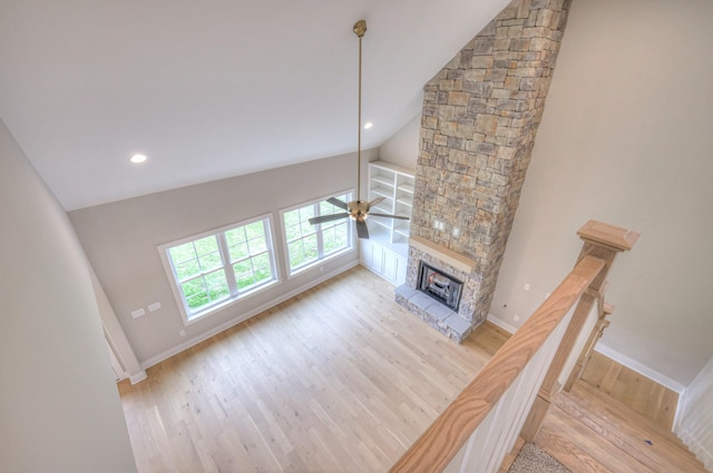 4016 Runyan Cv, Murfreesboro, TN 37127 - unfurnished living room with a fireplace, light wood-style flooring, ceiling fan, recessed lighting, and high vaulted ceiling