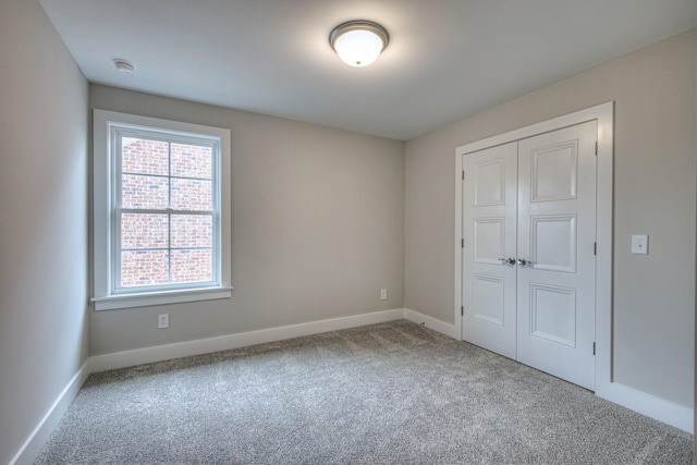 4016 Runyan Cv, Murfreesboro, TN 37127 - unfurnished bedroom featuring carpet, multiple windows, and a closet